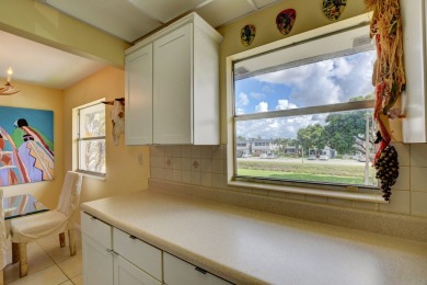 Welcome home to this move in ready 2nd floor corner in the on Kings Point Golf - Executive in Florida - for sale on GolfHomes.com, golf home, golf lot