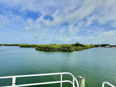 Live aboard boat slip offered in Sombrero Marina is 52' long; on Sombrero Golf and Country Club in Florida - for sale on GolfHomes.com, golf home, golf lot