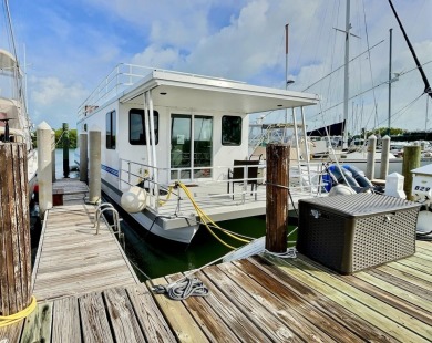 Live aboard boat slip offered in Sombrero Marina is 52' long; on Sombrero Golf and Country Club in Florida - for sale on GolfHomes.com, golf home, golf lot