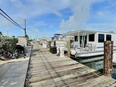 Live aboard boat slip offered in Sombrero Marina is 52' long; on Sombrero Golf and Country Club in Florida - for sale on GolfHomes.com, golf home, golf lot