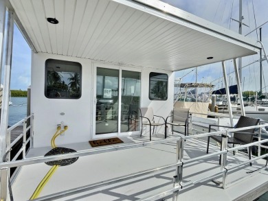 Live aboard boat slip offered in Sombrero Marina is 52' long; on Sombrero Golf and Country Club in Florida - for sale on GolfHomes.com, golf home, golf lot