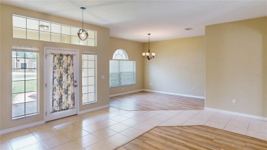 Welcome to this beautifully updated 5-bedroom, 3-bath pool home on The Grand Club - Pine Lakes Course in Florida - for sale on GolfHomes.com, golf home, golf lot