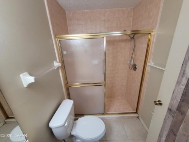 Located in the ST. ANDREWS section of Pelican Bay. Brick on The Club At Pelican Bay - North Course in Florida - for sale on GolfHomes.com, golf home, golf lot