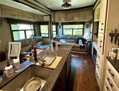 A luxury RV on a lot with a fantastic view and complete on Rancho California RV Resort in California - for sale on GolfHomes.com, golf home, golf lot