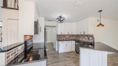 NEW ROOF 2023, NEW PLUMBING 2026, POOL CAGE 2023, HURRICANE on Fountain Lakes Community Golf Course in Florida - for sale on GolfHomes.com, golf home, golf lot