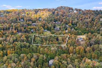Mountain view homesite, now triple the size. This combined 3-lot on Wolf Laurel Country Club in North Carolina - for sale on GolfHomes.com, golf home, golf lot