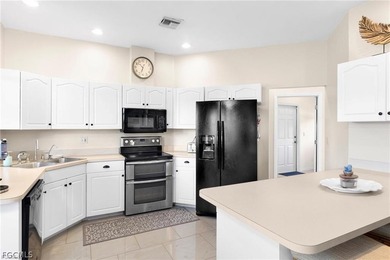 A charming front porch welcomes you to this spacious 1,782sf on Mirror Lakes Golf Club in Florida - for sale on GolfHomes.com, golf home, golf lot