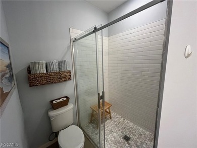 A charming front porch welcomes you to this spacious 1,782sf on Mirror Lakes Golf Club in Florida - for sale on GolfHomes.com, golf home, golf lot