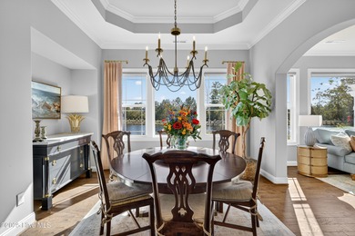 Exquisite home with a view of the pond located in the on Cape Fear National At Brunswick Forest in North Carolina - for sale on GolfHomes.com, golf home, golf lot