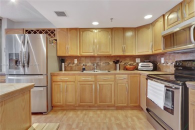 This exceptional corner unit comes with 2 cover parking spaces on Greynolds Park Golf Course in Florida - for sale on GolfHomes.com, golf home, golf lot