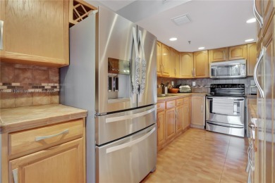 This exceptional corner unit comes with 2 cover parking spaces on Greynolds Park Golf Course in Florida - for sale on GolfHomes.com, golf home, golf lot