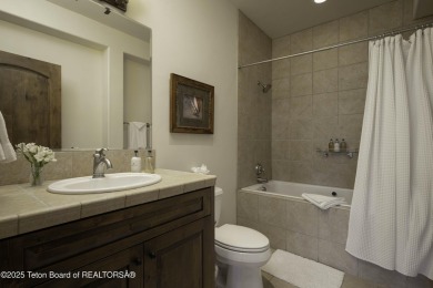 This beautifully maintained 4-bedroom, 4.5-bath log cabin in on Teton Springs Resort and Club in Idaho - for sale on GolfHomes.com, golf home, golf lot