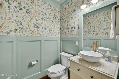 Exquisite home with a view of the pond located in the on Cape Fear National At Brunswick Forest in North Carolina - for sale on GolfHomes.com, golf home, golf lot