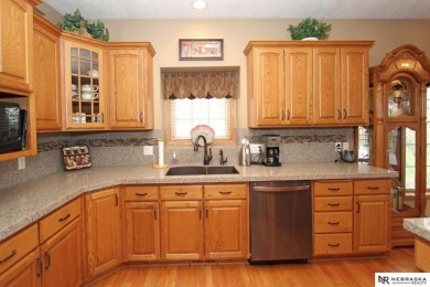 Beautiful all-brick ranch by Kinning Sydow featuring 4 bedrooms on Woodland Hills Golf Course in Nebraska - for sale on GolfHomes.com, golf home, golf lot