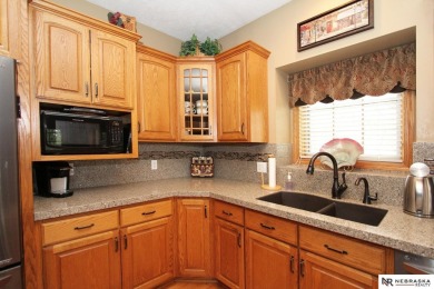 Beautiful all-brick ranch by Kinning Sydow featuring 4 bedrooms on Woodland Hills Golf Course in Nebraska - for sale on GolfHomes.com, golf home, golf lot