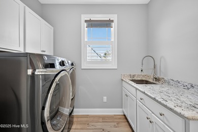 Exquisite home with a view of the pond located in the on Cape Fear National At Brunswick Forest in North Carolina - for sale on GolfHomes.com, golf home, golf lot