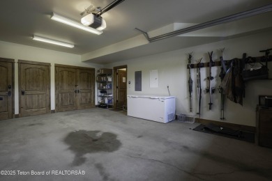This beautifully maintained 4-bedroom, 4.5-bath log cabin in on Teton Springs Resort and Club in Idaho - for sale on GolfHomes.com, golf home, golf lot