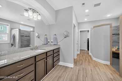 Exquisite home with a view of the pond located in the on Cape Fear National At Brunswick Forest in North Carolina - for sale on GolfHomes.com, golf home, golf lot