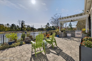 Exquisite home with a view of the pond located in the on Cape Fear National At Brunswick Forest in North Carolina - for sale on GolfHomes.com, golf home, golf lot