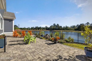 Exquisite home with a view of the pond located in the on Cape Fear National At Brunswick Forest in North Carolina - for sale on GolfHomes.com, golf home, golf lot