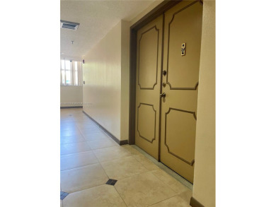 This exceptional corner unit comes with 2 cover parking spaces on Greynolds Park Golf Course in Florida - for sale on GolfHomes.com, golf home, golf lot