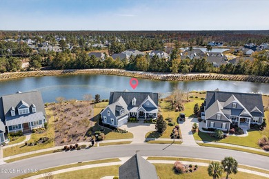 Exquisite home with a view of the pond located in the on Cape Fear National At Brunswick Forest in North Carolina - for sale on GolfHomes.com, golf home, golf lot