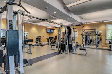 Exquisite home with a view of the pond located in the on Cape Fear National At Brunswick Forest in North Carolina - for sale on GolfHomes.com, golf home, golf lot