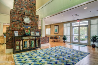 Exquisite home with a view of the pond located in the on Cape Fear National At Brunswick Forest in North Carolina - for sale on GolfHomes.com, golf home, golf lot