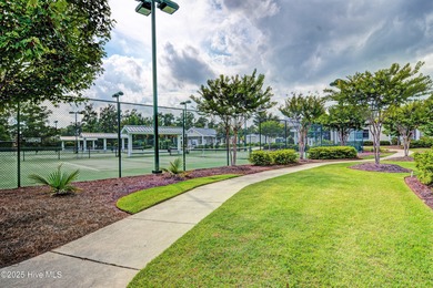 Exquisite home with a view of the pond located in the on Cape Fear National At Brunswick Forest in North Carolina - for sale on GolfHomes.com, golf home, golf lot