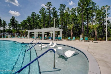 Exquisite home with a view of the pond located in the on Cape Fear National At Brunswick Forest in North Carolina - for sale on GolfHomes.com, golf home, golf lot