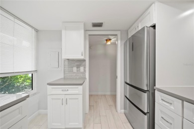 Enjoy ultimate convenience in this beautifully remodeled on Cove Cay Country Club in Florida - for sale on GolfHomes.com, golf home, golf lot