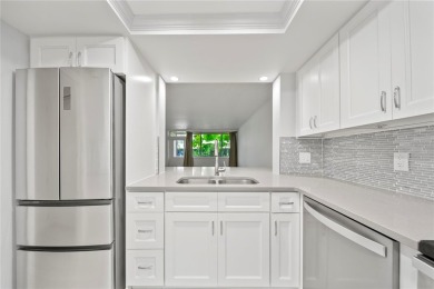 Enjoy ultimate convenience in this beautifully remodeled on Cove Cay Country Club in Florida - for sale on GolfHomes.com, golf home, golf lot