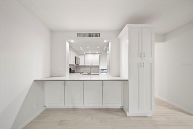Enjoy ultimate convenience in this beautifully remodeled on Cove Cay Country Club in Florida - for sale on GolfHomes.com, golf home, golf lot