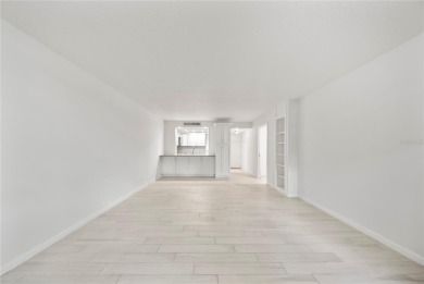 Enjoy ultimate convenience in this beautifully remodeled on Cove Cay Country Club in Florida - for sale on GolfHomes.com, golf home, golf lot