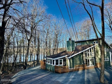 Welcome to your dream lake house retreat! This stunning property on Woodloch Pines Resort in Pennsylvania - for sale on GolfHomes.com, golf home, golf lot