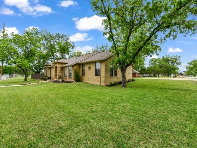 Welcome to 6100 Cherokee Dr, a warm and inviting retreat nestled on Pecan Plantation Country Club in Texas - for sale on GolfHomes.com, golf home, golf lot