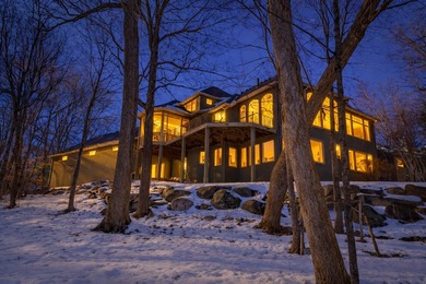 Tucked away at the end of a quiet cul-de-sac, this storybook on Bearpath Golf and Country Club in Minnesota - for sale on GolfHomes.com, golf home, golf lot