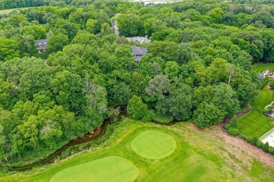 Tucked away at the end of a quiet cul-de-sac, this storybook on Bearpath Golf and Country Club in Minnesota - for sale on GolfHomes.com, golf home, golf lot