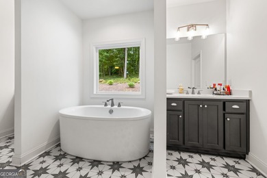 Nestled in the gated community of The Orchard Golf & Country on The Orchard Golf and Country Club in Georgia - for sale on GolfHomes.com, golf home, golf lot