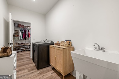 Nestled in the gated community of The Orchard Golf & Country on The Orchard Golf and Country Club in Georgia - for sale on GolfHomes.com, golf home, golf lot