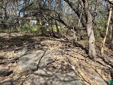 This buildable lot is located in the highly sought-after on De Cordova Bend Country Club in Texas - for sale on GolfHomes.com, golf home, golf lot