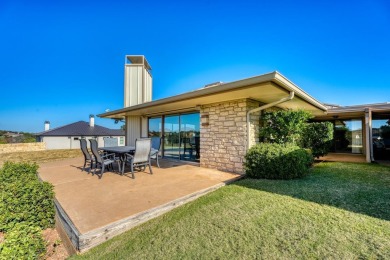Welcome to this charming single-level townhome at Escape West in on Apple Rock Golf Course - Horseshoe Bay in Texas - for sale on GolfHomes.com, golf home, golf lot