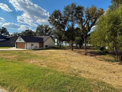 Open water lot on almost half acre in newer gated community on on Cedar Creek Country Club in Texas - for sale on GolfHomes.com, golf home, golf lot