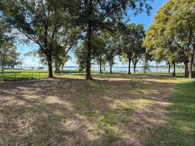 Open water lot on almost half acre in newer gated community on on Cedar Creek Country Club in Texas - for sale on GolfHomes.com, golf home, golf lot
