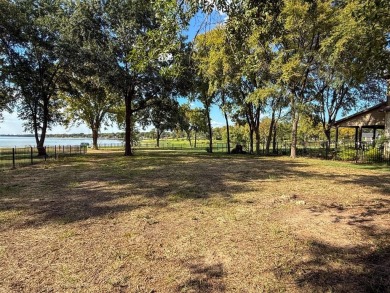 Open water lot on almost half acre in newer gated community on on Cedar Creek Country Club in Texas - for sale on GolfHomes.com, golf home, golf lot