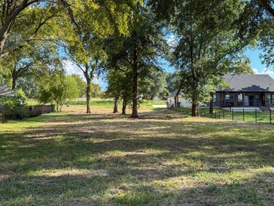 Open water lot on almost half acre in newer gated community on on Cedar Creek Country Club in Texas - for sale on GolfHomes.com, golf home, golf lot