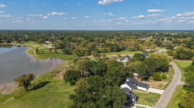 Open water lot on almost half acre in newer gated community on on Cedar Creek Country Club in Texas - for sale on GolfHomes.com, golf home, golf lot