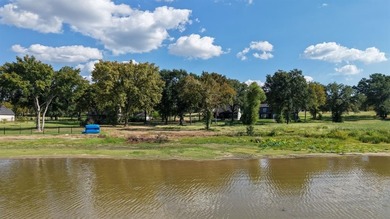 Open water lot on almost half acre in newer gated community on on Cedar Creek Country Club in Texas - for sale on GolfHomes.com, golf home, golf lot