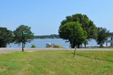 Beautiful sunsets and open water views from this corner lot on Cedar Creek Country Club in Texas - for sale on GolfHomes.com, golf home, golf lot