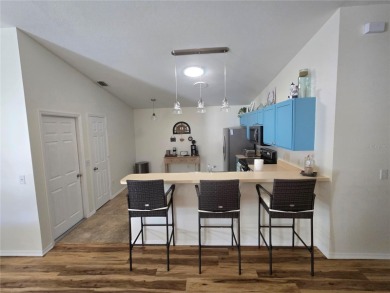 Fantastic location for this Villa in The Villages -- just on The Links of Spruce Creek in Florida - for sale on GolfHomes.com, golf home, golf lot